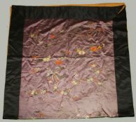 A LARGE CHINESE EMBROIDERED SILK PANEL, decorated on purple ground with a bird, butterfly, and