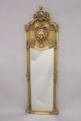 A LONG GILTWOOD MIRROR with lion masks. 5ft 9ins high, 1ft 7ins wide.