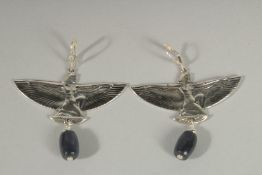 A PAIR OF SILVER FEMALE FIGURES AND WINGS EARRINGS.