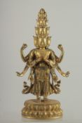 A GOOD BRONZE MULTI HEAD DEITY on an oval base.