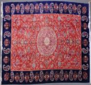 A VERY GOOD ISLAMIC CARPET, 20TH CENTURY, salmon pink with a rich blue border, having an allover