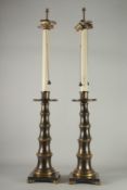 A TALL PAIR OF MARBLE AND BRONZE LAMPS. 43ins high.