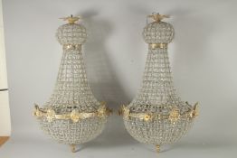 A PAIR OF CRYSTAL BEAD CHANDELIER. 32ins long.