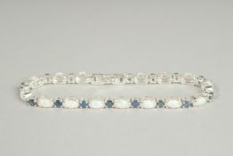 A SILVER SAPPHIRE AND OPAL SET LINE BRACELET..