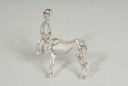 A SILVER ANATOMICAL SKELETON HORSE BROOCH.