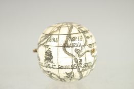 AN ETCHED BONE FOLDING GLOBE 1.5ins diameter.
