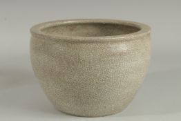 A CHINESE CRACKLE GLAZE CIRCULAR PLANTER. 10ins diameter.
