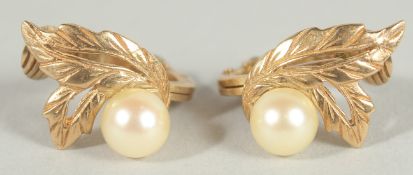 A PAIR OF 9CT GOLD AND PEARL EAR CLIPS.