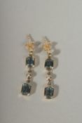 A PAIR OF 9CT GOLD TOPAZ AND PEARL LONG DROP EARRINGS.