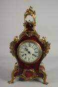 A 19TH CENTURY FRENCH TORTOISESHELL AND ONYX CLOCK with acanthus scrolls. 10ins high.