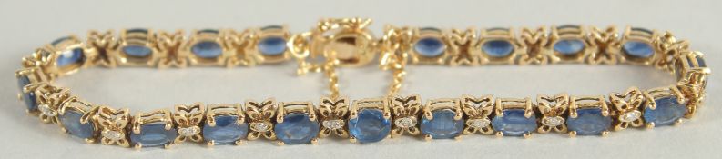 AN 18CT YELLOW GOLD, SAPPHIRE AND DIAMOND BRACELET.