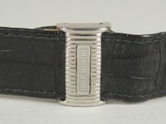 A BOUCHERON BLACK LEATHER STRAP in a Boucheron black leather case.