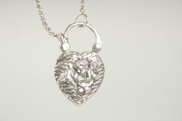 A SILVER AND MOTHER OF PEARL CHERUB LOCKET AND CHAIN.