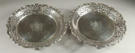 A VERY GOOD PAIR OF WALKER AND HALL SILVER DISHES with pierced sides on three claw and ball feet.