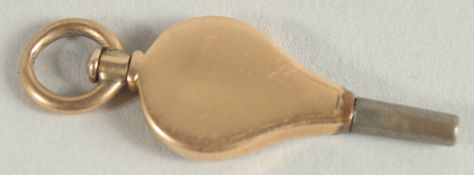 A SMALL 9CT GOLD WATCH KEY with metal tip.