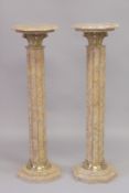 A GOOD PAIR OF BEIGE MARBLE COLUMNS with octagonal tops. 3ft 4ins high.