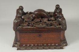 A SUPERB UNUSUAL 19TH CENTURY MAHOGANY CASKET, the top carved with pelicans on either corner and a