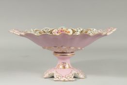A SEVRES DESIGN OVAL TWO HANDLED TAZZA with panel of flowers. 13ins high.