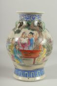 A CHINESE PORCELAIN VASE painted with flowers with four hands. 12ins high.