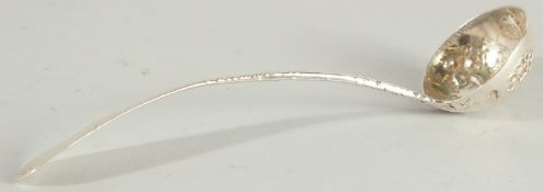 A SMALL ENGRAVED SILVER LADLE.