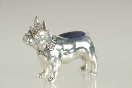A NOVELTY SILVER PLATED FRENCH BULL DOG PIN CUSHION. 2.5ins long.