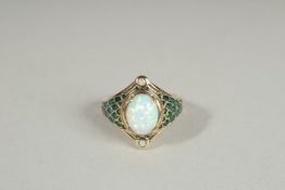 A 9CT GOLD OPAL AND EMERALD RING.