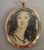 AN EDWARDIAN OVAL MINIATURE OF A YOUNG LADY.
