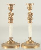A GOOD PAIR OF REGENCY DESIGN ROCK CRYSTAL CIRCULAR CANDLESTICKS after Thomas Hope, on circular