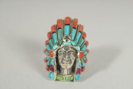A SILVER TURQUOISE AND CORAL NATIVE AMERICAN RING.