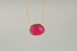 A SILVER RUBY PENDANT AND CHAIN.