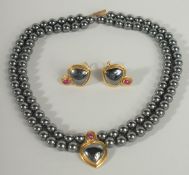 A D & F 9CT GOLD TWO ROW NECKLACE AND EAR CLIPS, boxed.