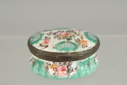 A BILSTON BLUE OVAL BOX painted with flowers. 2ins x 1.5ins.