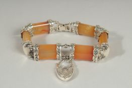 A SILVER AND AGATE SCOTTISH TOGLE BRACELET with thistle lock.
