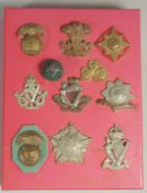 A COLLECTION OF 12 IRISH BADGES including I S H ROYAL MUNSTER, THE LEINSTER, INNISKILLING.