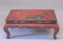 A CHINESE RED LACQUERED RECTANGULAR TOP TABLE on four curving legs. 3ft 4ins long, 2ft wide.
