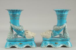 A PAIR OF SEVRES DESIGN LIGHT BLUE CORNUCOPIA BOARS HEAD VASES. 11ins high.