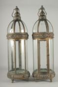 A LARGE PAIR OF COPPER AND GLASS CIRCULAR LANTERNS. 31ins high.
