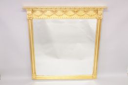 A LARGE GILTWOOD OVERMANTLE MIRROR. 4ft 11ins high, 4ft 11ins wide.