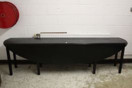 A GOOD PLAIN MAHOGANY IRISH DROP FLAP WAKE TABLE with oval sides. 7ft long.