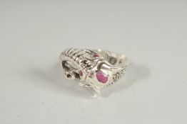 A SILVER RUBY SET ELEPHANT RING.