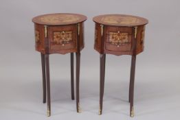 A GOOD PAIR OF LOUIS XVITH STYLE INLAID OVAL BEDSIDE TABLES with three drawers on curving legs.