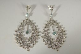 A PAIR OF SILVER MARCASITE, BLUE TOPAZ EARRINGS.