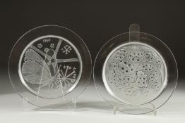TWO LALIQUE CIRCULAR GLASS PLATES. 1961 & 1974. 8.24ins diameter.