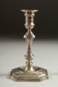 A GARRARD & CO. SILVER TAPER STICK with loaded base. 4.5ins London 1908.