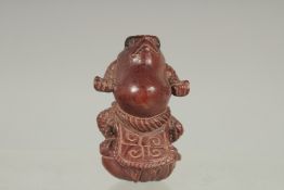 A STANDING FROG CARVED WOOD NETSUKE. Signed.