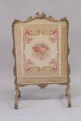 A GOOD 19TH CENTURY FRENCH GILTWOOD FIRE SCREEN with needlework panel. 3ft 7ins high 2ft 2ins wide.