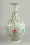 A CHINESE BULBOUS VASE painted with flowers and birds in famille rose. Six character mark in blue.