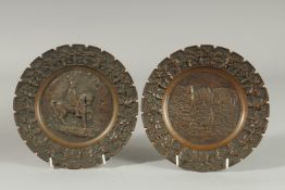 A GOOD PAIR OF CAST BRONZE CIRCULAR PLATES.