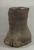 A LATE 19TH CENTURY EARLY 29TH CENTURY ELEPHANT FOOT STICK STAND, the inset top with copper banded