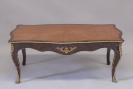A LOUIS XVITH STYLE KINGWOOD RECTANGULAR TOP COFFEE TABLE with star top on curving legs. 4ft 2ins